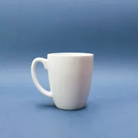 White ceramic mug on a blue background